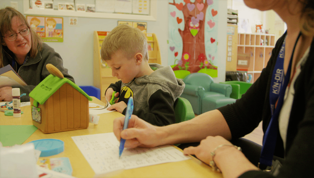 A kid cutting paper